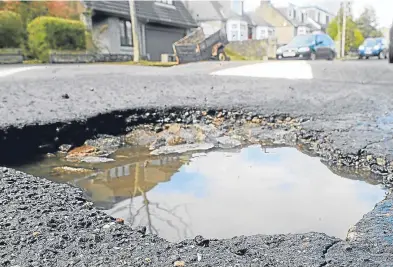  ?? Picture: Chris Sumner. ?? A pothole on Morningsid­e Road in Aberdeen.