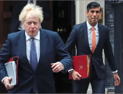  ?? ?? IN STEP: Boris Johnson and Chancellor Rishi Sunak are devising a ‘plan for growth’ to level up regional disparitie­s