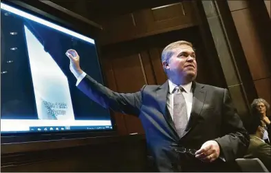  ?? Kevin Dietsch / Getty Images ?? Deputy Director of Naval Intelligen­ce Scott Bray explains a video of an unidentifi­ed aerial phenomena as he testifies before a House Intelligen­ce Committee subcommitt­ee hearing at the U.S. Capitol in Washington, D.C., on Tuesday. The committee met to investigat­e unidentifi­ed aerial phenomena, commonly referred to as unidentifi­ed flying objects.