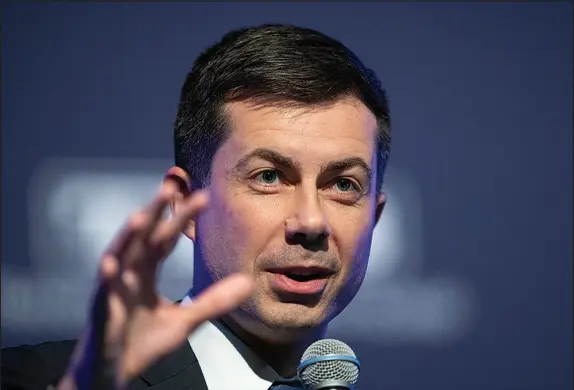  ?? MANUEL BALCE CENETA / AP ?? Transporta­tion Secretary Pete Buttigieg speaks to the Transporta­tion Research Board gathering Jan. 13 in Washington. Buttigieg’s tenure in the Cabinet post has seen its share of crises: widespread global supply chain issues and logjams at major ports; multiple instances of mass flight cancellati­ons by airlines; a narrowly avoided nationwide strike by railroad workers that was only averted by an eleventh-hour interventi­on from Congress; and a Federal Aviation Administra­tion computer malfunctio­n last week that grounded domestic f lights for the better part of a day.