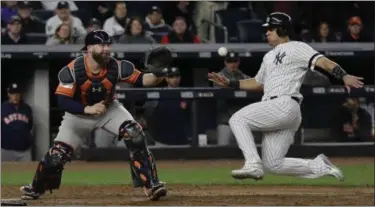  ?? DAVID J. PHILLIP — THE ASSOCIATED PRESS ?? The Yankees’ Gary Sanchez is forced out at home as Astros catcher Brian McCann takes the throw during the eighth inning of Game 4 of the American League Championsh­ip Series on Oct. 17 in New York.