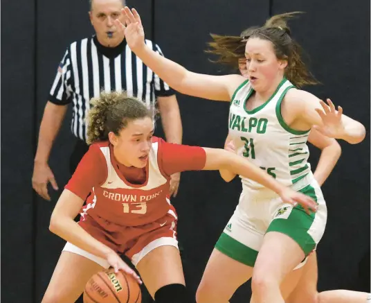  ?? JOHN SMIERCIAK/POST-TRIBUNE PHOTOS BELOW: ?? ABOVE: Valparaiso’s Mackenzie Wassermann, right, guards Crown Point’s Brooke Lindesmith during a game in the first round of the Class 4A Lowell Sectional on Wednesday. Valparaiso’s Kristin Bukata, left, guards Crown Point’s Ava Ziolkowski.