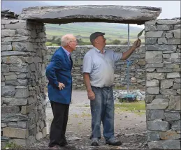  ?? Photo by Valerie O’Sullivan ?? Stone mason Gerry Clifford with local historian and author Junior Murphy, as the front slab was placed at the entrace to ‘Sive Ringfort’ on the outskirts of Cahersivee­n town.