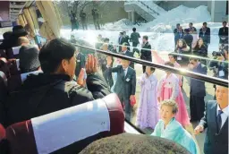  ??  ?? South Koreans aboard a bus wave goodbye to their North Korean relatives as they leave for a family reunion at the resort area of Mount Kumgang, North Korea in February, 2014. (AFP)