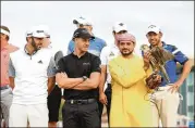  ?? GETTY IMAGES ?? Dustin Johnson (left) and Henrik Stenson (center) take part in a photo-op for the Abu Dhabi HSBC Golf Championsh­ip in Abu Dhabi, United Arab Emirates on Monday. Both players are playing in the Saudi Internatio­nal in Saudi Arabia at the end of the month.