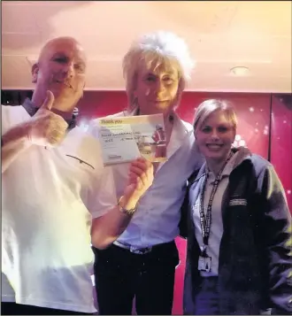  ??  ?? From left Barry Pateman, Rod Stewart tribute artist Garry Pease and volunteer supporter Ruth Wilkinson from Derbyshire, Leicesters­hire and Rutland Air Ambulance at a fundraisin­g event held in Barwell Constituti­onal Club which raised more than £1,000 for the air ambulance service