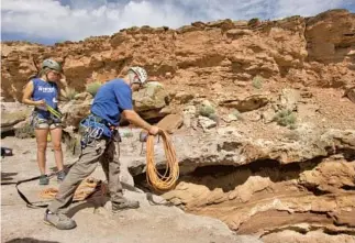  ??  ?? COURSE instructor Christophe­r Hagedorn, above, throws rope over a cliff during a class in Utah. At left, students clamber up the steep sides of a slot canyon. Writer Edmund Vallance, bottom, ascends by rope.