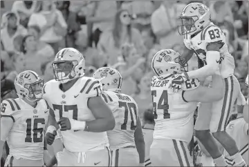  ?? Matthew Hinton / The Associated Press ?? LSU players celebrate after the team scores a touchdown during the first half of Saturday’s game against Auburn.