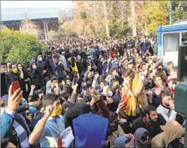  ?? STUDENTS Associated Press ?? attend a protest at Tehran University in a 2017 photo from an individual not employed by the Associated Press and obtained by the AP outside Iran.