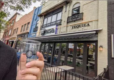  ?? PHOTO COURTESY OF THE CITY OF ROYAL OAK ?? Nearly 10,000drinks have been sold in Royal Oak’s social district since participat­ing bars and restaurant­s began selling beer, wine and mixed drinks for outdoor consumptio­n about seven weeks ago.