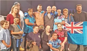  ?? Photo: Leone Cabenatabu­a ?? World middleweig­ht kick boxing champion Carlos Hicks with family in Auckland, New Zealand on March 17, 2018.