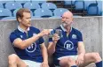  ??  ?? Sam Heughan, left, and Graham McTavish participat­e in Scottish sports in the series.