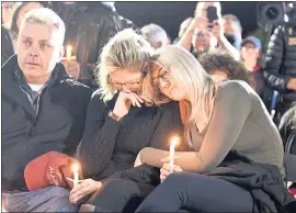  ?? HANS PENNINK — THE ASSOCIATED PRESS ?? Family members and friends gather for a candleligh­t vigil memorial at Mohawk Valley Gateway Overlook Pedestrian Bridge in Amsterdam, N.Y., on Monday.