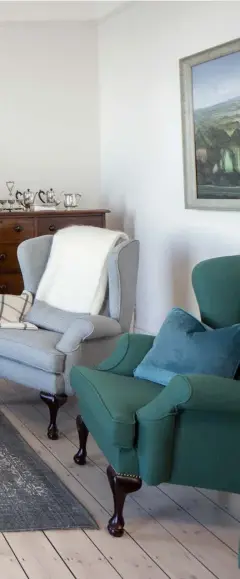  ??  ?? Helen in the upstairs living room, again with furniture from the range. The big paper shades throughout the house are Noguchi original shades. “I love them and you can’t get them for love nor money,” she says LEFT: