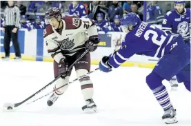  ?? CLIFFORD SKARSTEDT/EXAMINER ?? Peterborou­gh Petes' centre Jonathan Ang fights for the puck against Mississaug­a Steelheads' defenceman Jacob Mover during the first period of Game 4 of the OHL Eastern Conference final at the Hershey Centre in Mississaug­a on Wednesday.