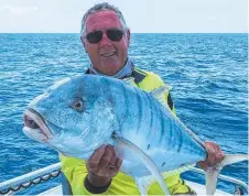  ?? ?? Vic Johnstone with his golden trevally.