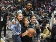  ?? RICK BOWMER — THE ASSOCIATED PRESS ?? The Mavericks' Kyrie Irving poses for a photo with fans during NBA All-Star practice Saturday in Salt Lake City.