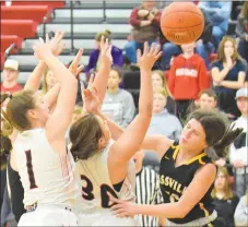  ?? RICK PECK/SPECIAL TO MCDONALD COUNTY PRESS ?? McDonald County’s Laney Wilson gets fouled going for a rebound during the Lady Mustangs’ 54-49 loss to Cassville on Jan. 28 at MCHS as teammate Caitlyn Barton helps out.