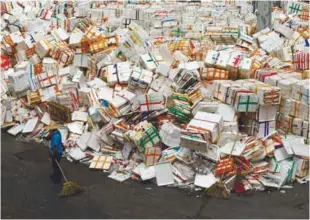  ?? REUTERSPIX ?? A cleaner working next to empty polyfoam boxes which are piled up at the Wholesale Food Market in Hong Kong yesterday after China barred truck drivers from taking them back across the border. –