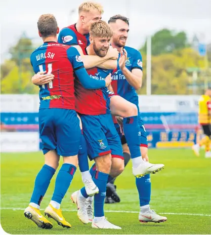  ??  ?? Inverness players surround Shaun Rooney after he scores their second goal