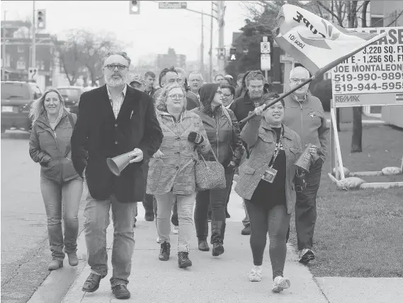  ?? PHOTOS: NICK BRANCACCIO ?? CUPE members from around the province, including Niagara Region’s Jeff Vreeken, front left, and London’s Anne Marie Apau, front right, join the picket line Friday at Canadian Hearing Society office on Giles Boulevard East. Locally, 13 workers have been...