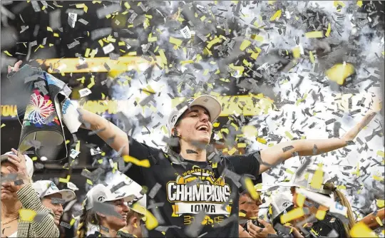  ?? PHOTOS BY ABBIE PARR/ASSOCIATED PRESS ?? Iowa guard Caitlin Clark celebrates Sunday after the overtime victory over Nebraska in the final of the Big Ten women’s tournament in Minneapoli­s. Iowa regularly plays in front of full crowds as fans clamor to see Clark, and the women’s conference tournament sold out for the first time this year.