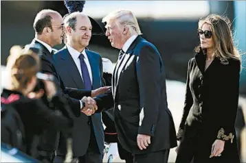  ?? MASSIMO PERCOSSI/EPA ?? Italian Foreign Minister Angelino Alfano, left, and ambassador nominee Lewis Eisenberg greet Donald and Melania Trump.