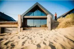  ??  ?? The Blue House opens directly onto a sandy beach (Camber Holiday Cottages)