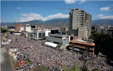  ?? AP ?? Anti-government protesters take part in a nationwide demonstrat­ion demanding the resignatio­n of President Nicolas Maduro, in Caracas, Venezuela.