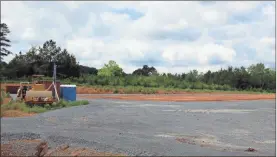  ?? / Kevin Myrick ?? Above: The site is ready to go for the new Agricultur­e Education building at Rockmart High School. Below: A space behind this part of the campus at Cedartown High School will soon be transforme­d in the coming year into a new auditorium and band room.