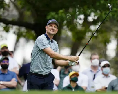  ?? Associated Press ?? Justin Rose tees off on the fourth hole of Friday’s second round of the Masters at Augusta National Golf Club. A day after he shot 65 for a four-shot lead, he came back to the field.