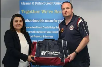  ??  ?? Halala Ahmadi, Marketing & Business Developmen­t Officer of Kilsaran & District Credit Union Ltd., presents Stuart Reynolds, Captain of O’Connells’ GFC, a set of kit bags for their Intermedia­te Championsh­ip Final.