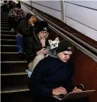  ?? ?? Shelter...Kyiv residents in subway