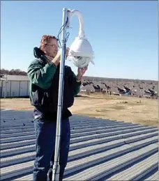  ?? Photograph submitted ?? Frank Baer installed the Weather Bug camera on top of the gymnasium roof at Pea Ridge High School.