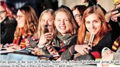  ??  ?? Fans gather as the stars of ‘Fantastic Beasts: The Crimes of Grindelwal­d’ arrive for the premier of the film in Paris on Thursday. — AFP photo