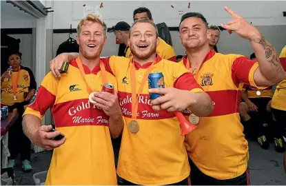  ?? GETTY IMAGES ?? Thames Valley's Matt Fisher, Reece Broughton and Matthew Abraham toasting their victory in South Canterbury.