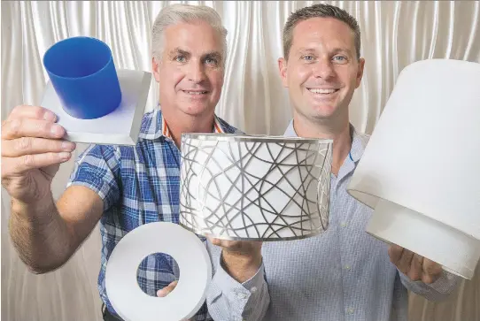  ?? WAYNE CUDDINGTON/ OTTAWA CITIZEN ?? Inventor Kory Keogan, right, and business partner Mike Fleming have developed three styles of EzClipse shades and covers to dress up recessed lights.