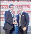  ??  ?? Sunil John, Founder & CEO of ASDA’A Burson-Marsteller (left), receiving the award from Ali Akawi Managing Director of ITP Publishing Group Ltd.