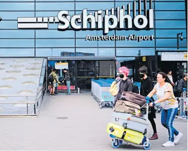  ?? ?? Amsterdam’s Schiphol Airport, where a baggage malfunctio­n caused problems