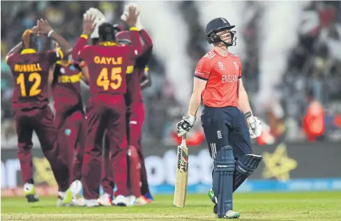  ?? AFP ?? England captain Eoin Morgan, right, reacts during the T20 World Cup final against the West Indies in 2016.