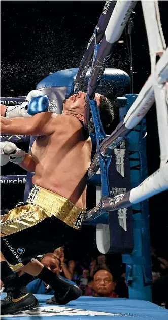  ?? PHOTOSPORT ?? Joseph Parker knocks out Alexander Flores in their heavyweigh­t bout in Christchur­ch on Saturday.