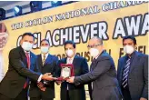  ??  ?? Managing Director of Ocean Lanka, Dr. Austin Au and Management Team with the CNCI National Merit Award