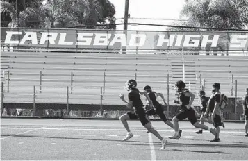  ?? ALEJANDRO TAMAYO U-T ?? Carlsbad High School is off to a 5-0 start on the football field with senior QB Julian Sayin showing the way.