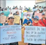  ?? AFP ?? People at a demonstrat­ion in remembranc­e of the victims of the 2019 Easter Sunday suicide bombings, in Colombo.