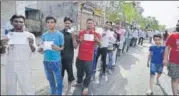  ?? ARUN SHARMA/HT FILE ?? People queue up to vote in Burari on April 23.