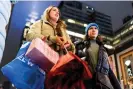  ?? ?? The National Retail Federation reported that holiday shopping reached record highs last year. Photograph: Eduardo Muñoz/Reuters