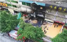  ?? AP ?? This aerial photo shows the fire accident site of a karaoke bar in Yingde City, South China’s Guangdong Province, yesterday.