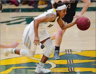  ?? SARAH GORDON/THE DAY ?? New London senior captain Rosi Nicholson, executing a steal during the Whalers’ Class L state tournament victory over Pomperaug on Feb. 11, was widely considered the team’s defensive wizard. Nicholson made two state championsh­ip appearance­s during her...