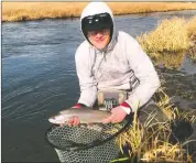  ?? ?? Zach William from Glendale finally caught a trophy rainbow trout from the upper Owens River while fishing with Sierra Bright Dot.