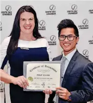  ??  ?? Melissa R. Peros, of Variety Care, is pictured with Teacher of the Year Philip Nguyen, of Bryant Elementary in Moore.